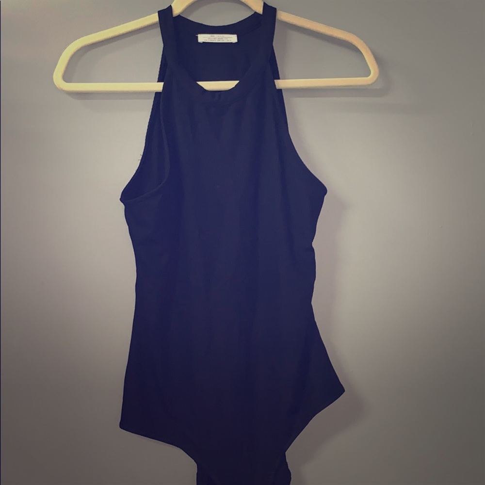 (ZARA) A black body suit.